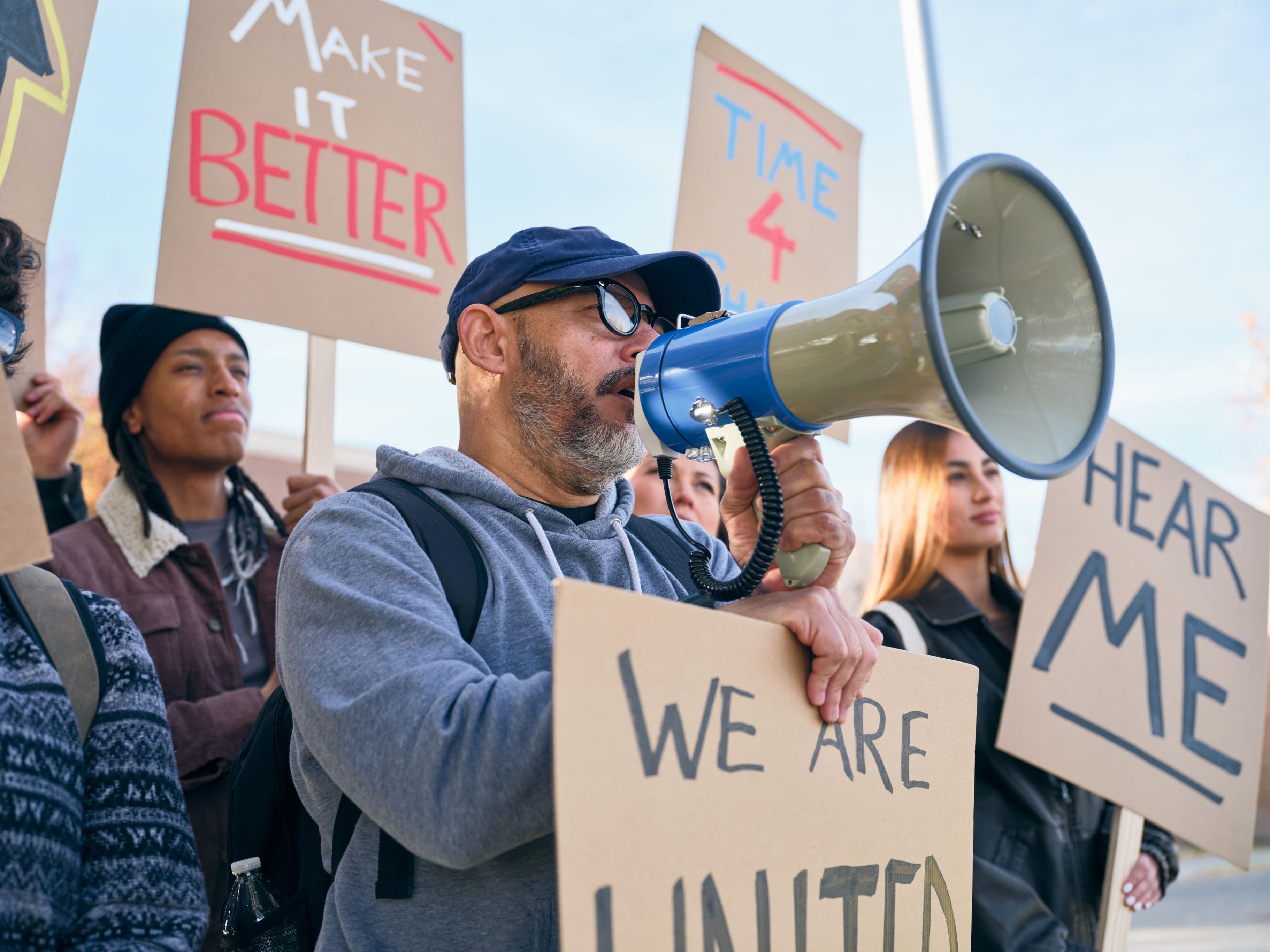 People holding up signs at a protest