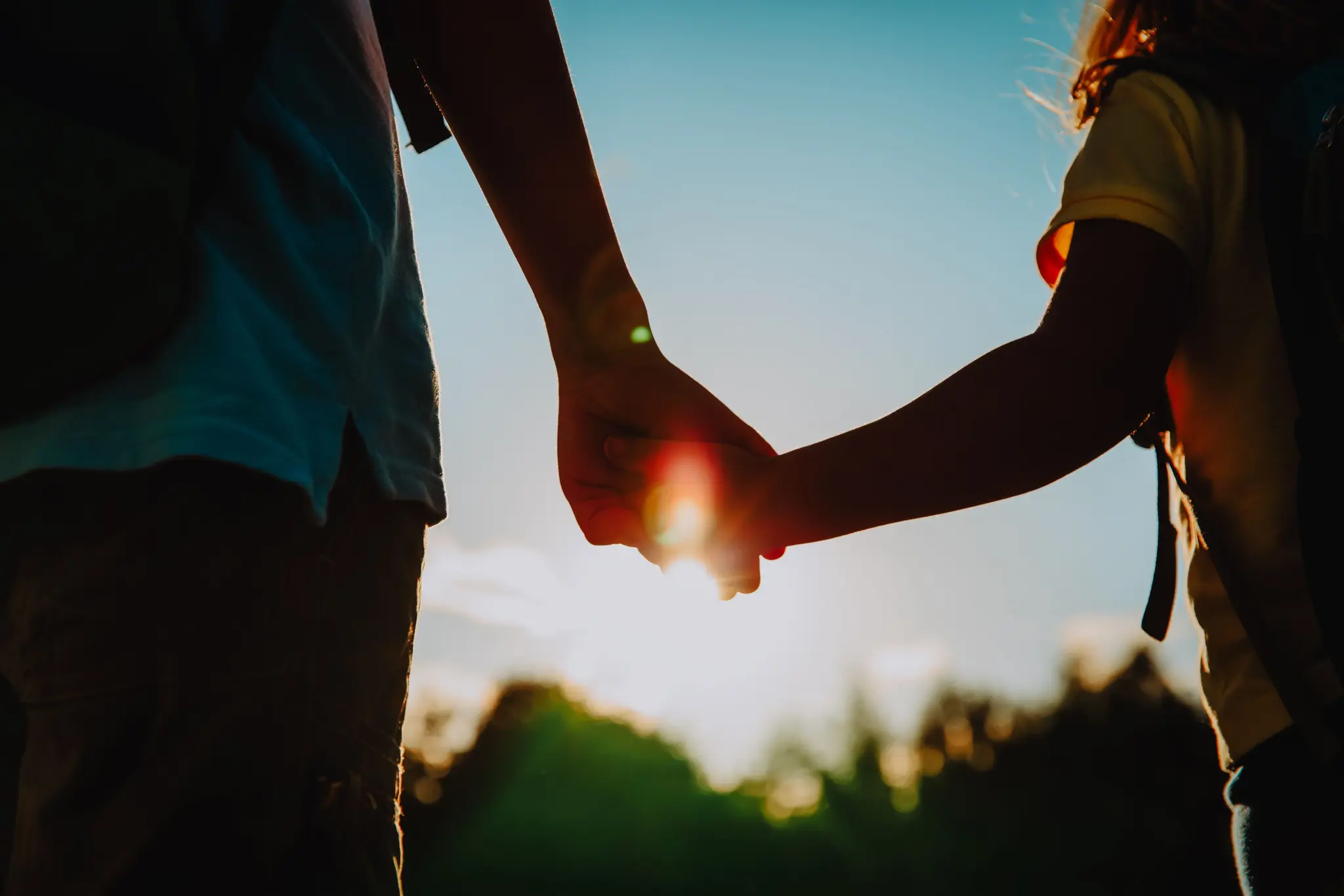 Parent and child holding hands