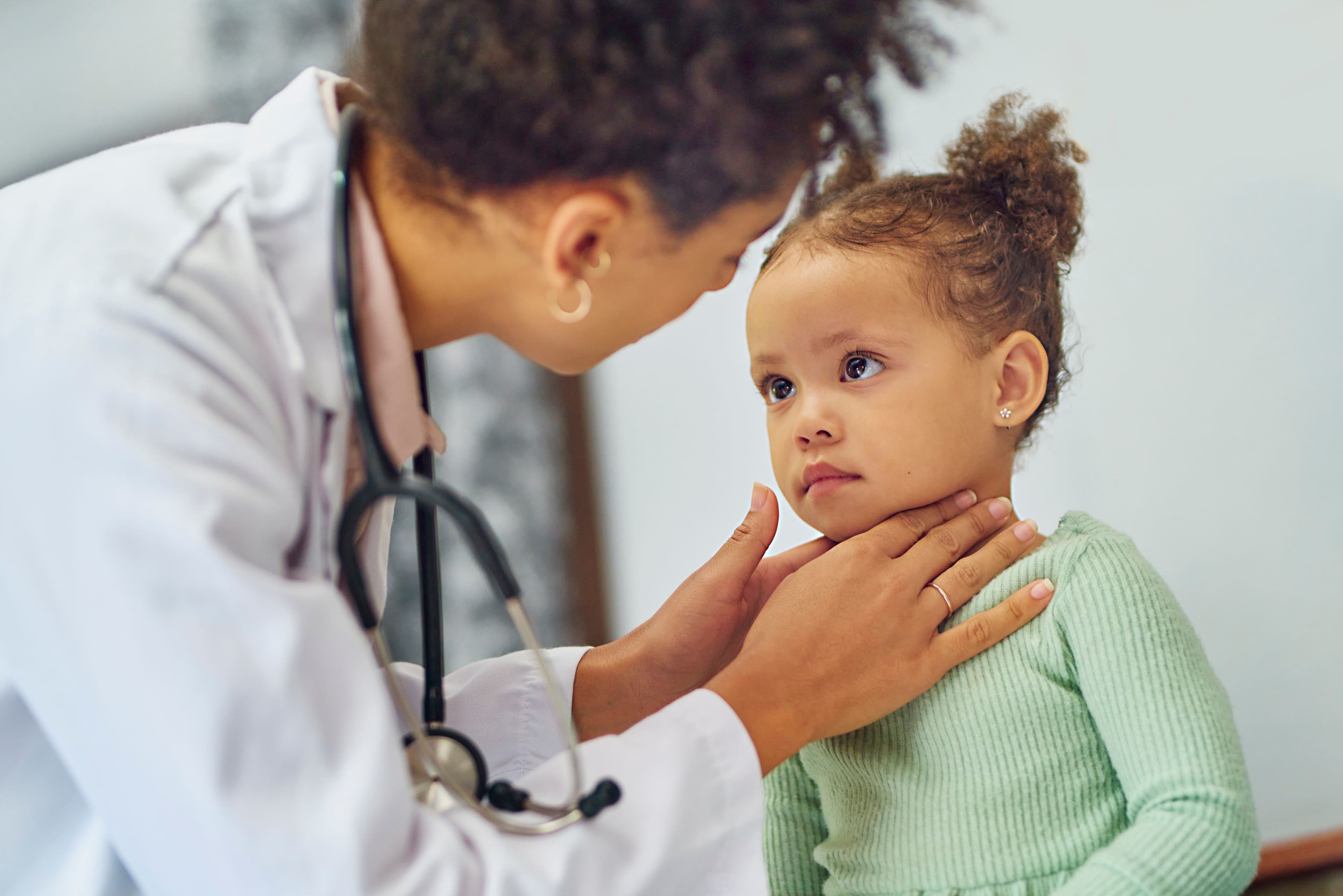 Doctor examining a child